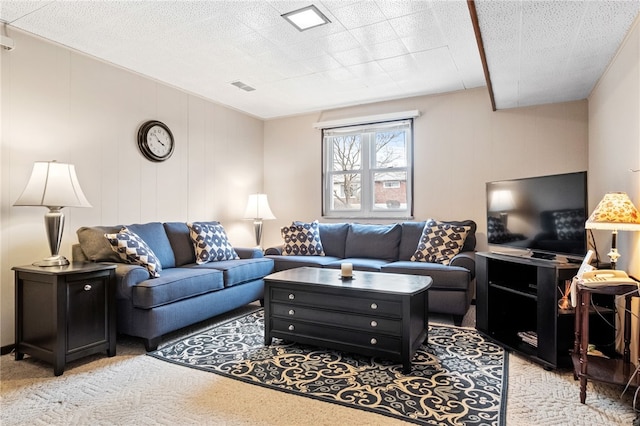 living room with visible vents and light carpet