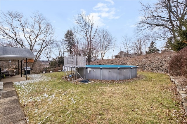 view of yard with an outdoor pool and a patio