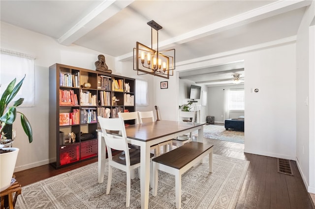 dining space with visible vents, beam ceiling, baseboards, and wood-type flooring