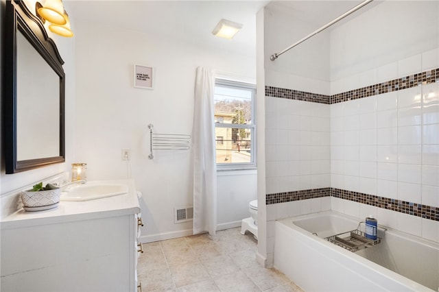 full bath with vanity, a bath, visible vents, tile patterned floors, and toilet