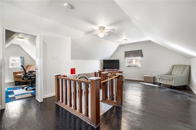 additional living space with hardwood / wood-style flooring, a wealth of natural light, and vaulted ceiling