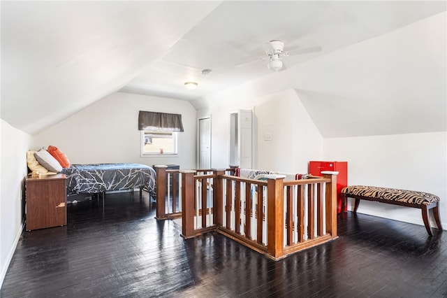 bedroom with ceiling fan, baseboards, lofted ceiling, and hardwood / wood-style flooring