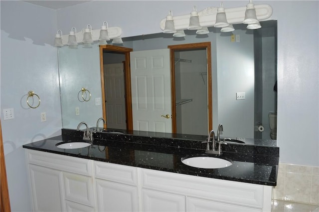 bathroom featuring double vanity and a sink