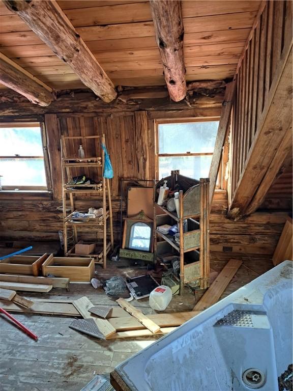 miscellaneous room featuring beamed ceiling and wood ceiling