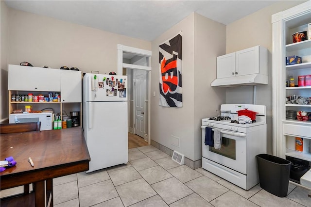 kitchen featuring visible vents, under cabinet range hood, white appliances, white cabinets, and light tile patterned floors