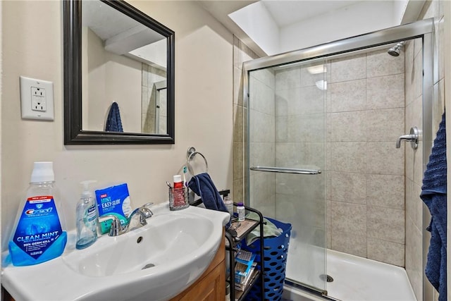 full bathroom featuring a stall shower and vanity