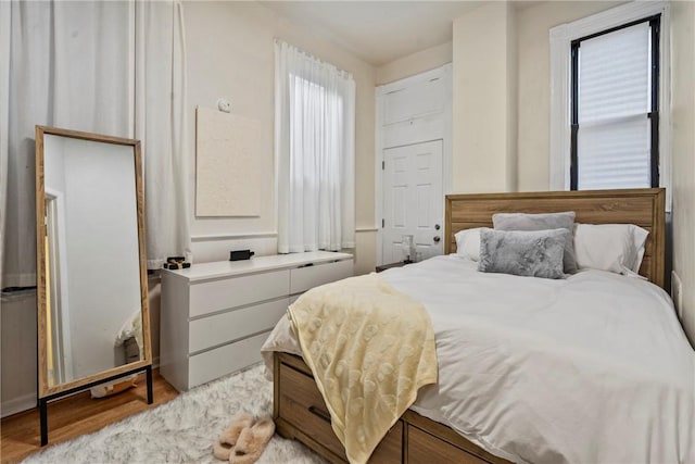 bedroom featuring light wood-style floors