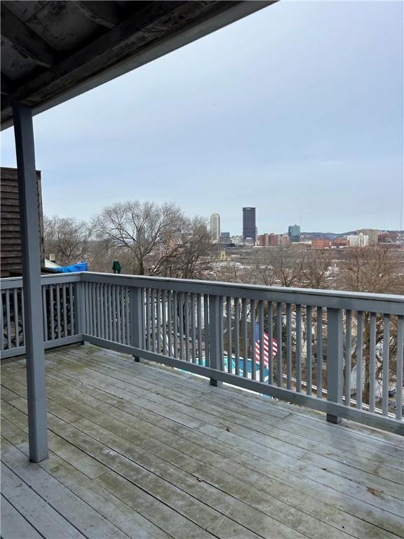 wooden terrace with a city view