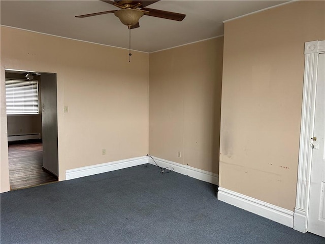 spare room with baseboards, dark colored carpet, baseboard heating, and ceiling fan