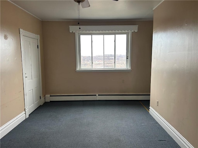 spare room featuring crown molding, carpet, baseboards, and a baseboard radiator