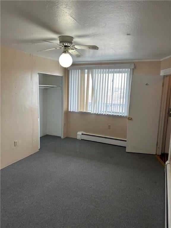 unfurnished bedroom with a baseboard radiator, ceiling fan, a closet, a textured ceiling, and baseboard heating