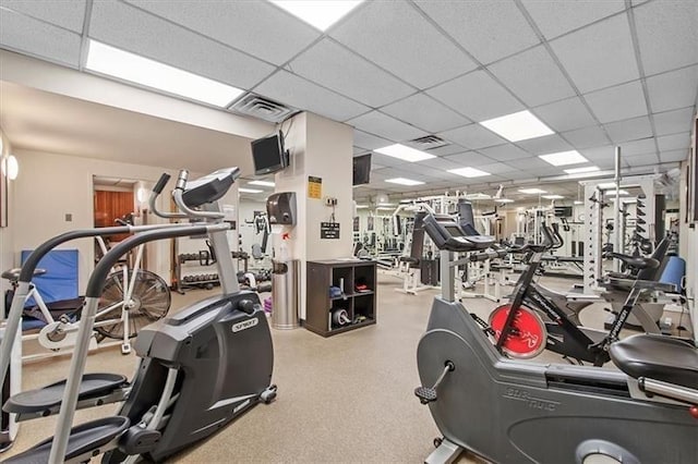 workout area featuring a drop ceiling and visible vents