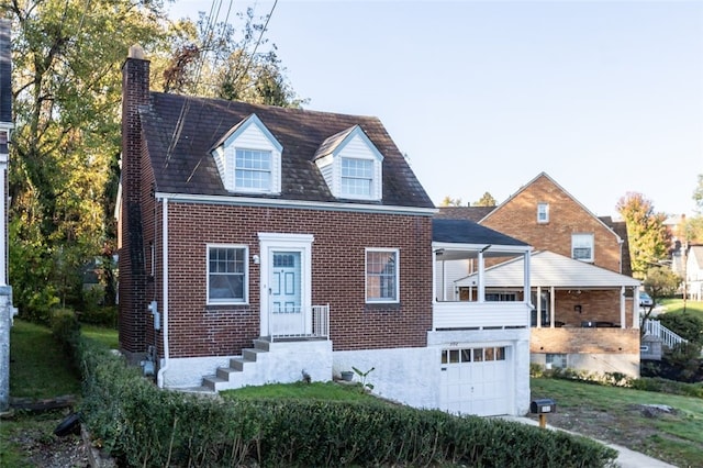 cape cod-style house featuring brick siding, a chimney, and a garage