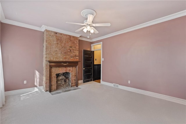 unfurnished living room with visible vents, a brick fireplace, crown molding, baseboards, and a ceiling fan