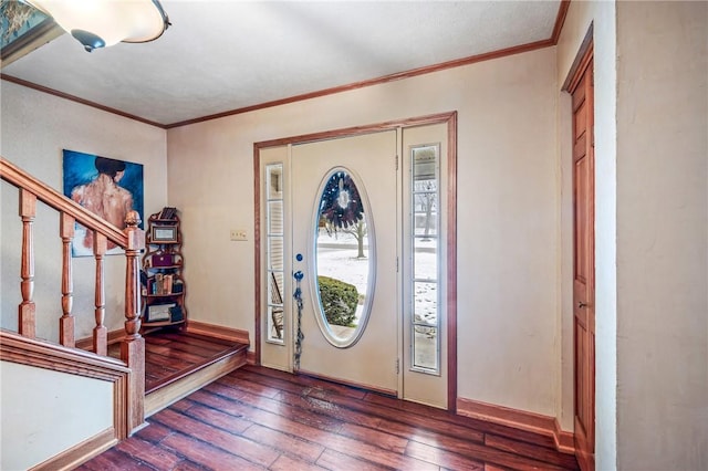foyer entrance with stairs, hardwood / wood-style flooring, and ornamental molding