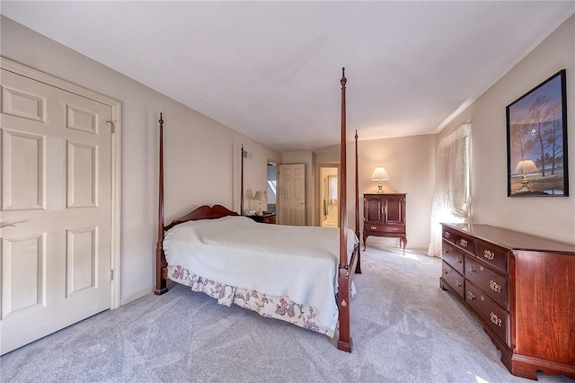 carpeted bedroom featuring baseboards