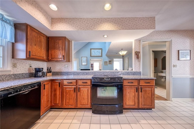 kitchen featuring wallpapered walls, black appliances, plenty of natural light, and brown cabinets