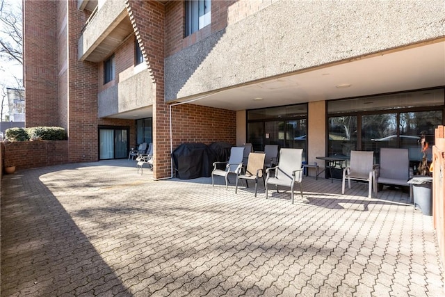 view of patio featuring a grill