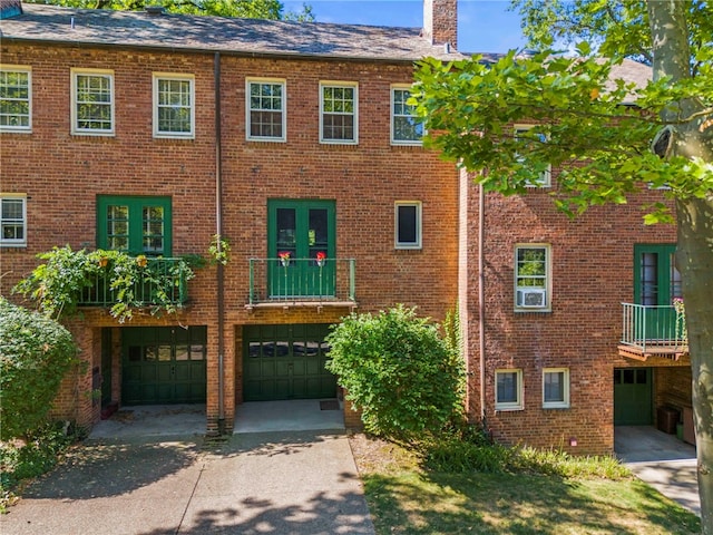 view of building exterior featuring driveway and a garage