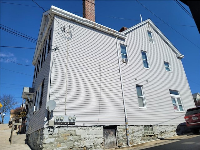 view of side of property featuring a chimney