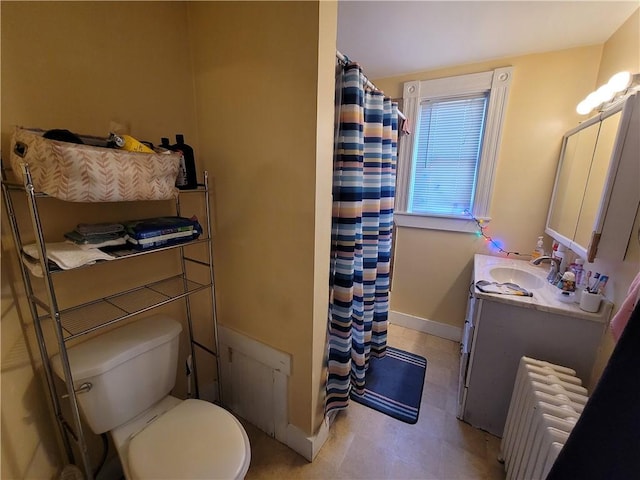 full bathroom with toilet, a shower with curtain, radiator heating unit, baseboards, and vanity