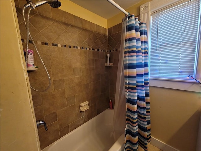 bathroom featuring shower / bathtub combination with curtain