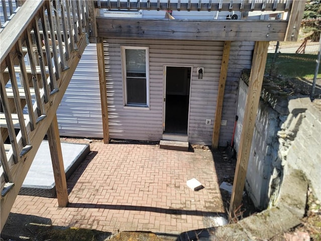 entrance to property featuring a patio