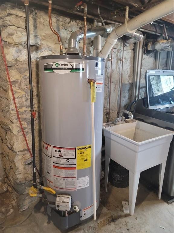 utility room featuring gas water heater