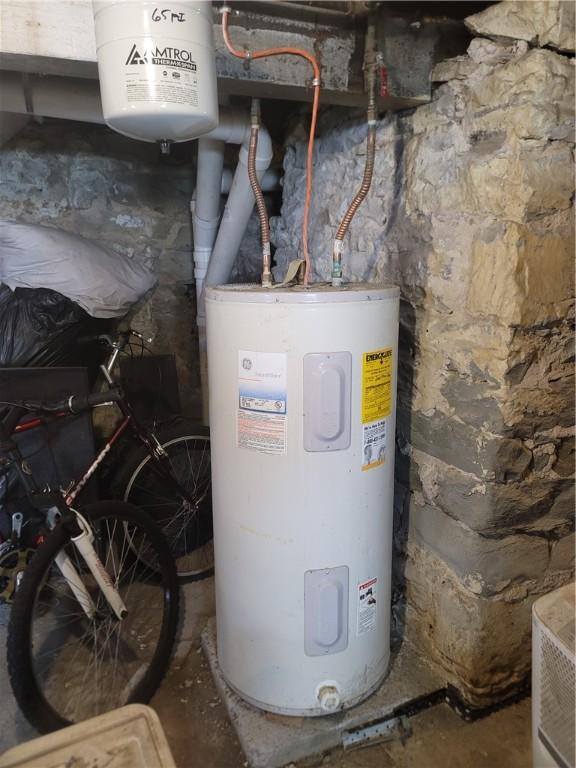 utility room with water heater