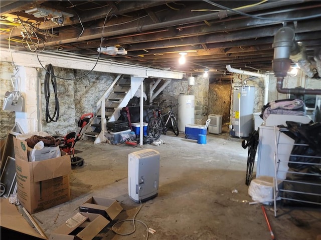 unfinished below grade area with gas water heater and water heater