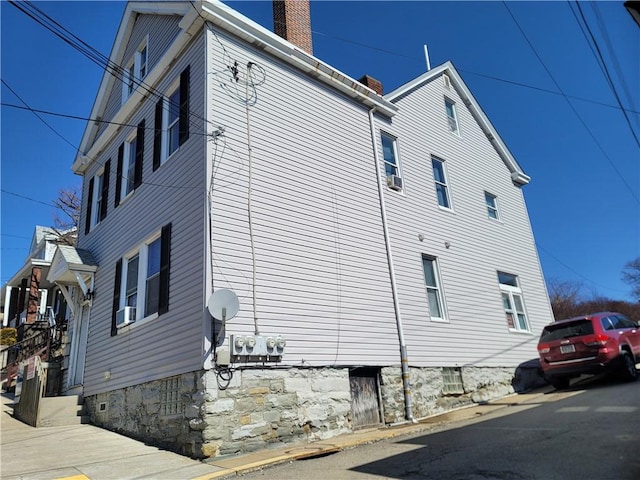 view of side of property with a chimney