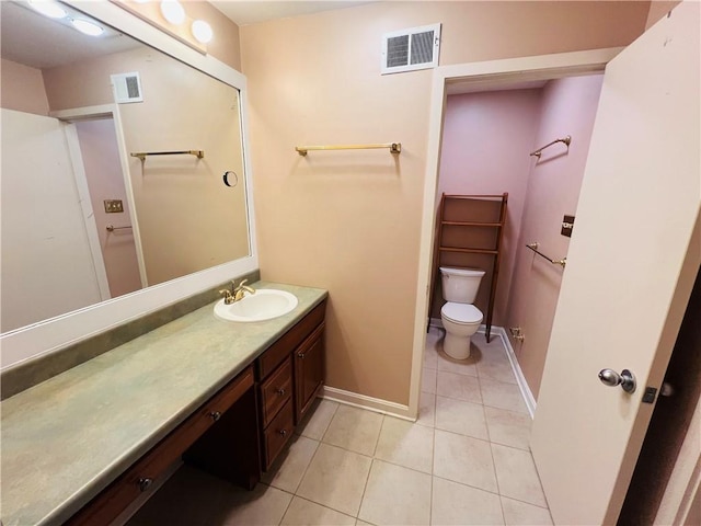 bathroom with tile patterned flooring, visible vents, baseboards, toilet, and vanity