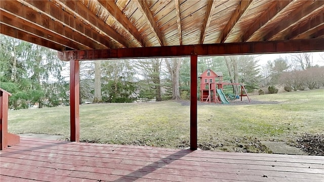 wooden terrace with a yard and a playground