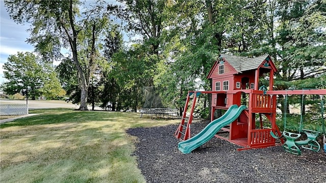 view of jungle gym featuring a trampoline and a yard