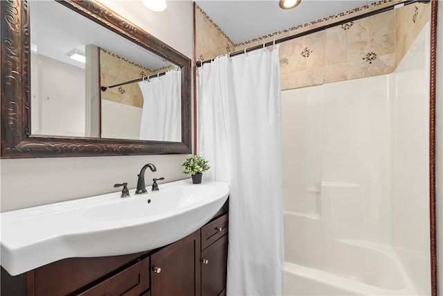 full bathroom with vanity and shower / tub combo with curtain