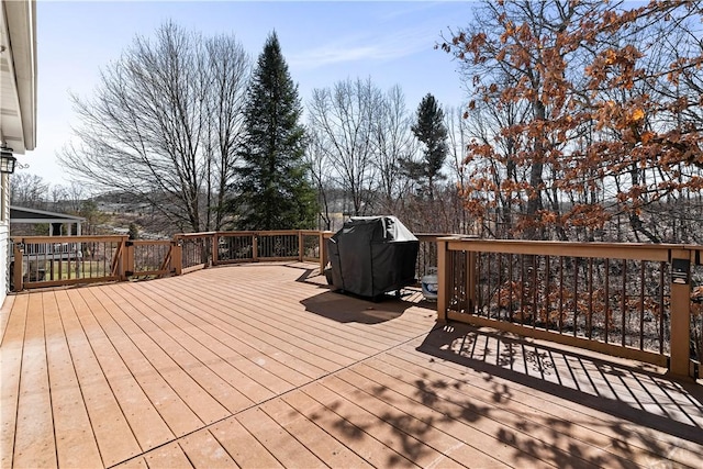 wooden terrace featuring grilling area