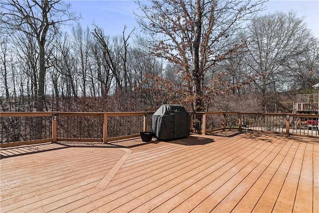 wooden deck featuring area for grilling