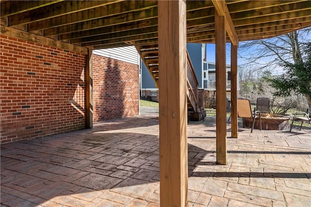 view of patio / terrace with an outdoor fire pit