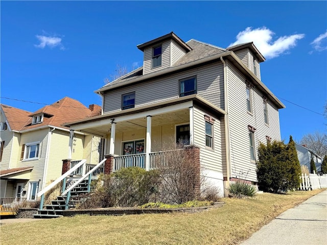 traditional style home featuring covered porch