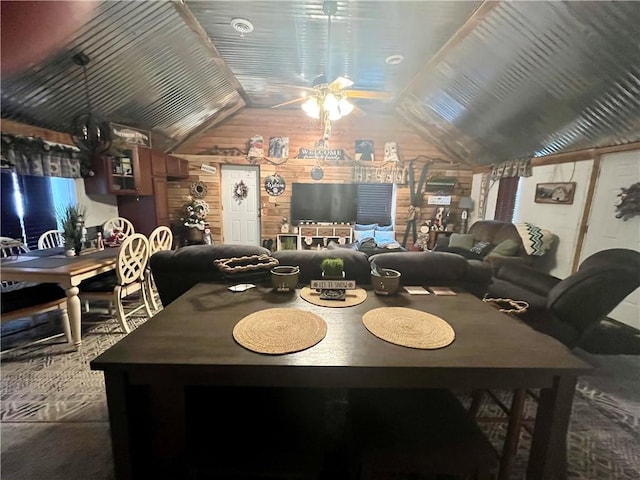 dining area featuring a ceiling fan and vaulted ceiling