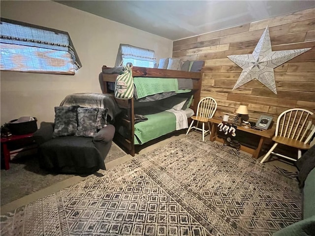 bedroom with wood walls