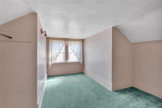 additional living space featuring baseboards, carpet floors, and lofted ceiling