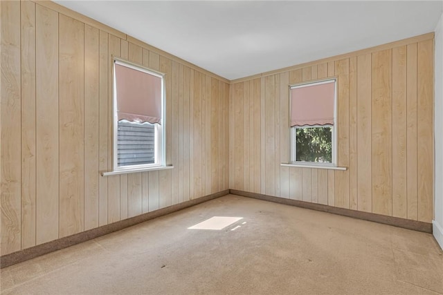 unfurnished room featuring baseboards and carpet flooring