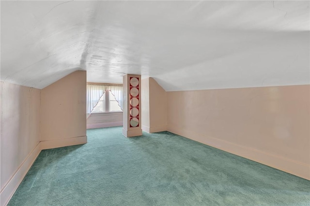 bonus room with baseboards, carpet floors, and lofted ceiling