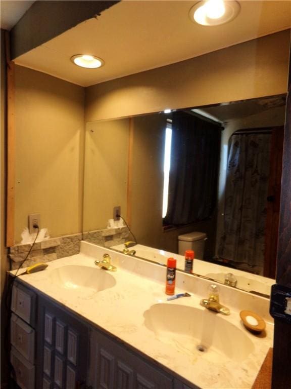 bathroom with double vanity and a sink