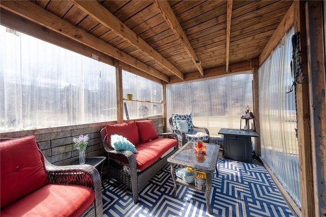 sunroom featuring beam ceiling and wooden ceiling