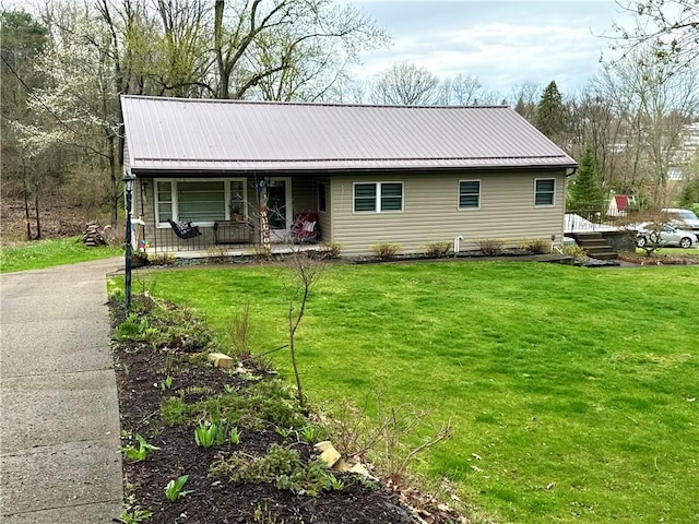 99 Logan Rd, North Fayette, PA 15126 - single story home with a front yard, a porch, and metal roof