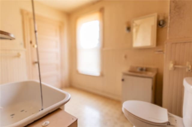 full bath featuring toilet and a sink