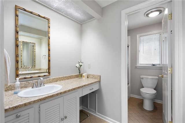 bathroom featuring visible vents, toilet, vanity, and baseboards