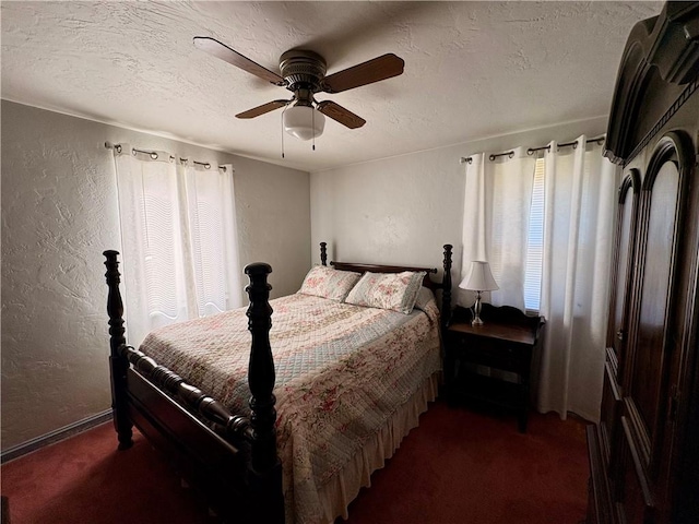 carpeted bedroom with a textured ceiling, ceiling fan, and a textured wall